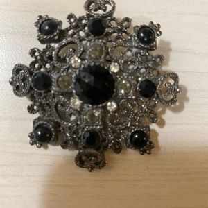 Silver starburst brooch